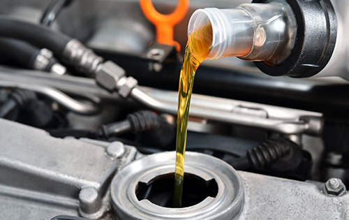 Adding engine oil during Mazda oil service
